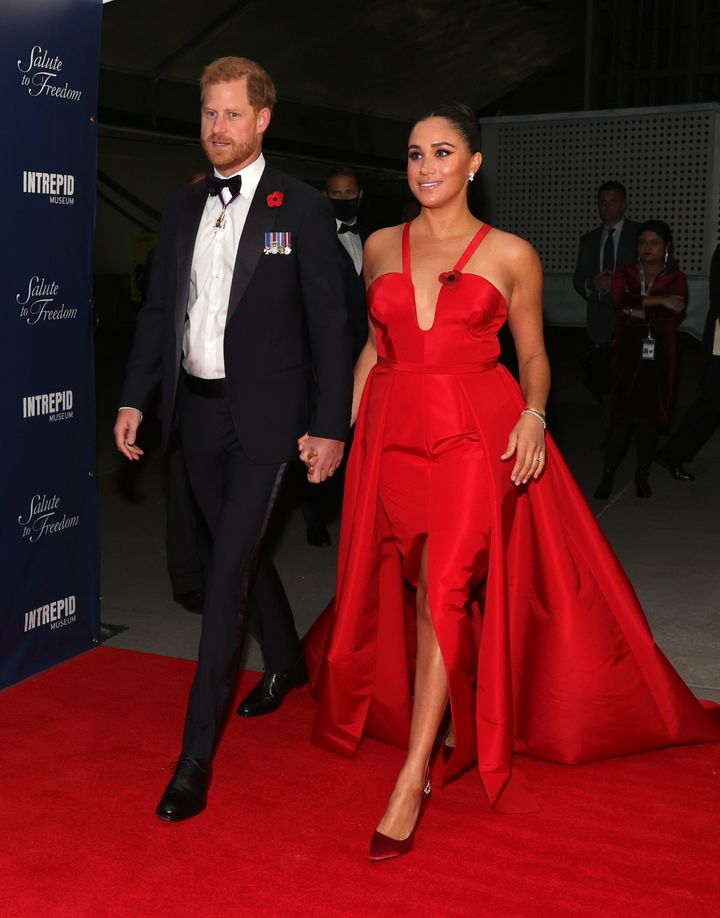 The Duke wore a classic black tux for the event, while the Duchess of Sussex donned a red Carolina Herrera dress. 