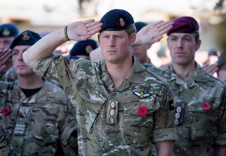 Prince Harry salutes at a Remembrance Sunday service at Kandahar Airfield on Nov. 9, 2014, in Afghanistan.