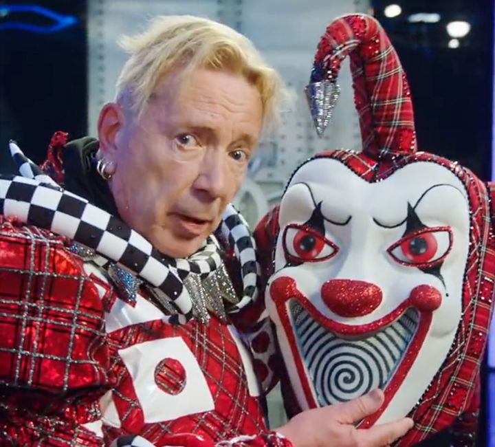 John Lydon posing with his Jester mask