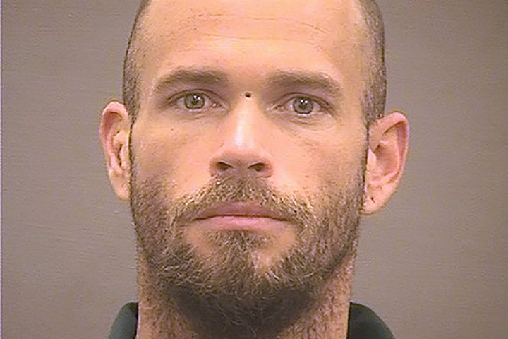 Chansley, who donned a horned headdress and face paint during the attack on the U.S. Capitol, poses for an undated booking photograph at the William G. Truesdale Adult Detention Center in Alexandria, Virginia.