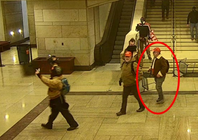 Brad Rukstales grabs a chair during the riot at the U.S. Capitol on Jan. 6.