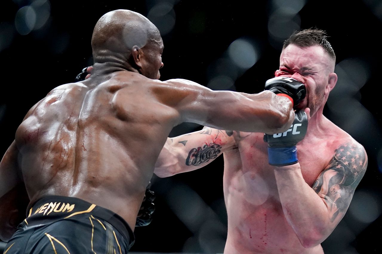 Kamaru Usman lands a punch against Colby Covington during a welterweight mixed martial arts championship bout at UFC 268, in New York, on Nov. 7. 