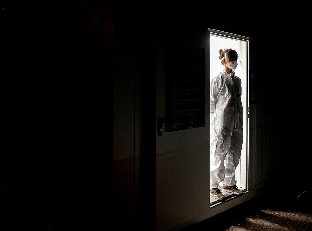 A medical worker stands in the doorway of a COVID-19 test center in Frankfurt, Germany, on Nov. 8. 