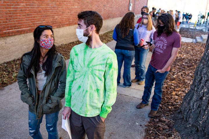 Voters wait in line outside the Gallatin County Courthouse in Bozeman, Montana, home of Montana State University, Nov. 3, 2020.