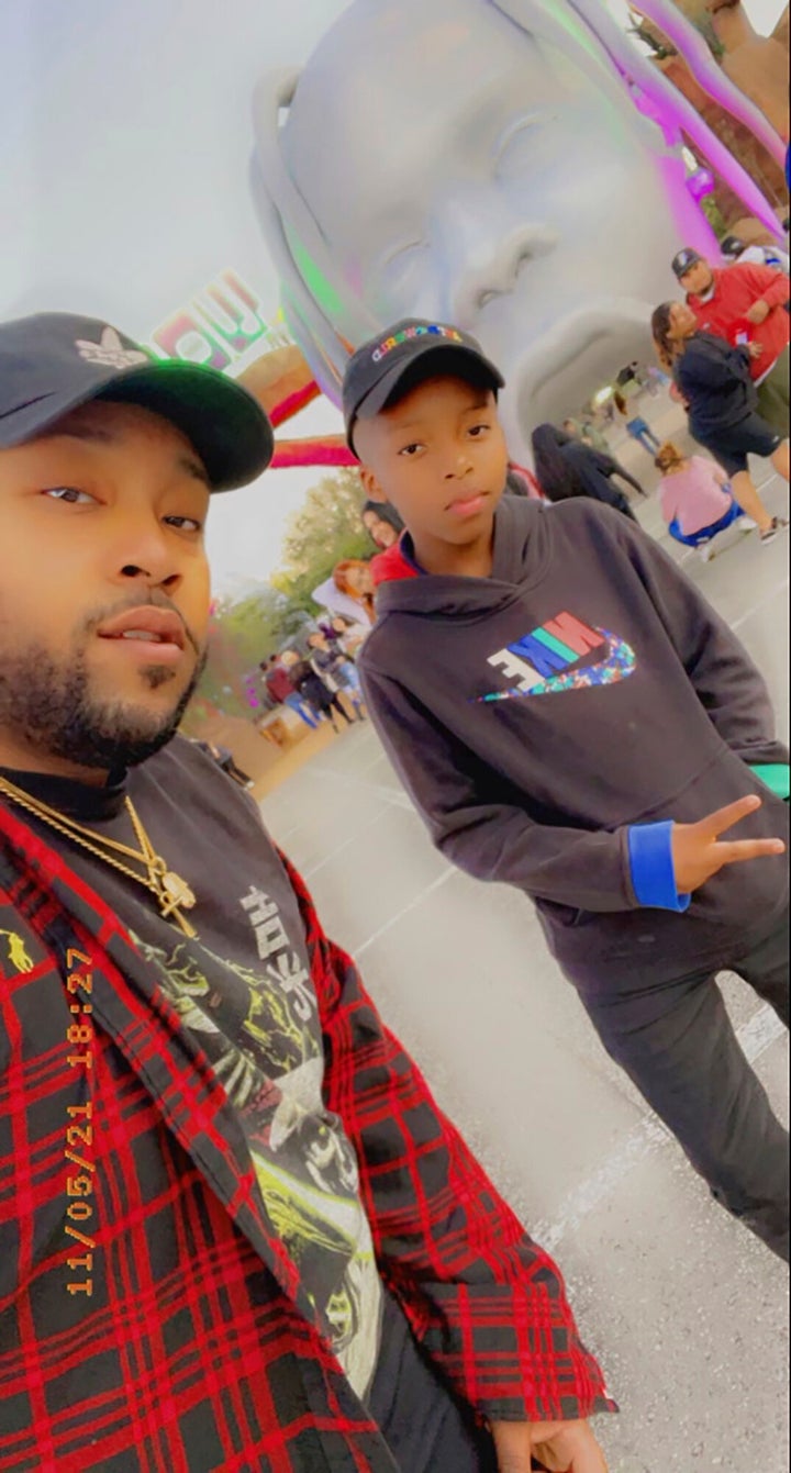This photo provided by Taylor Blount shows Ezra Blount, right, and his father, Treston Blount, left, posing outside the Astroworld music festival in Houston. Both were injured later at the concert during a crowd surge. (Courtesy of Taylor Blount via AP) qhiukiuiqkeinv