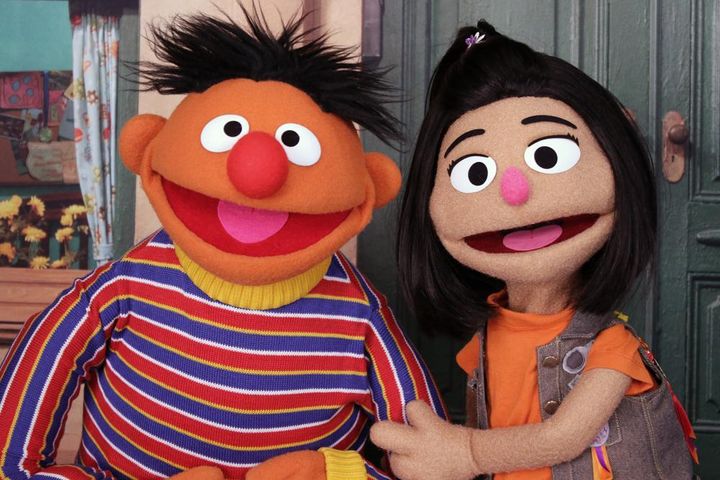 Ernie, a muppet from the popular children's series "Sesame Street," appears with new character Ji-Young, the first Asian American muppet, on the set of the long-running children's program in New York. Ji-Young is Korean American and has two passions: rocking out on her electric guitar and skateboarding.