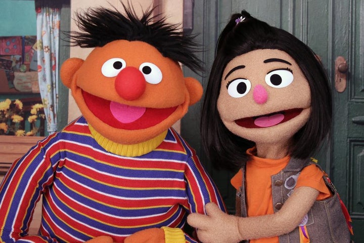 Ernie, a muppet from the popular children's series "Sesame Street," appears with new character Ji-Young, the first Asian American muppet, on the set of the long-running children's program in New York. Ji-Young is Korean American and has two passions: rocking out on her electric guitar and skateboarding.