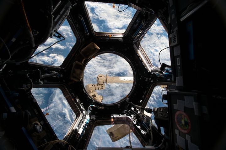 This June 4, 2015 photo shows the Cupola, a 360-degree observation area and remote control location for grappling, docking and undocking spacecraft on the International Space Station. (Scott Kelly/NASA via AP)