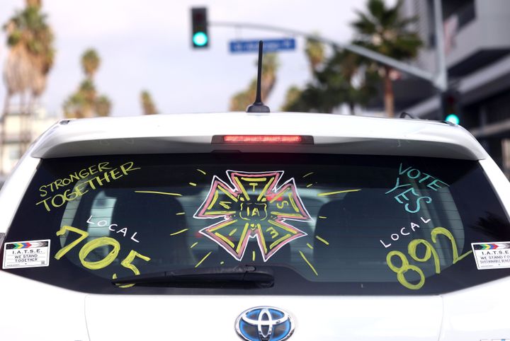 A driver displays their support for IATSE as workers fought for a new contract with the studios.