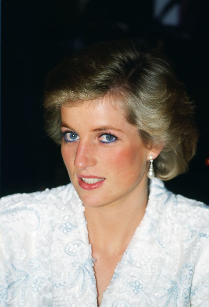 Princess Diana at a 1988 dinner party in France wearing what came to be her signature blue eyeliner, applied along her waterline.