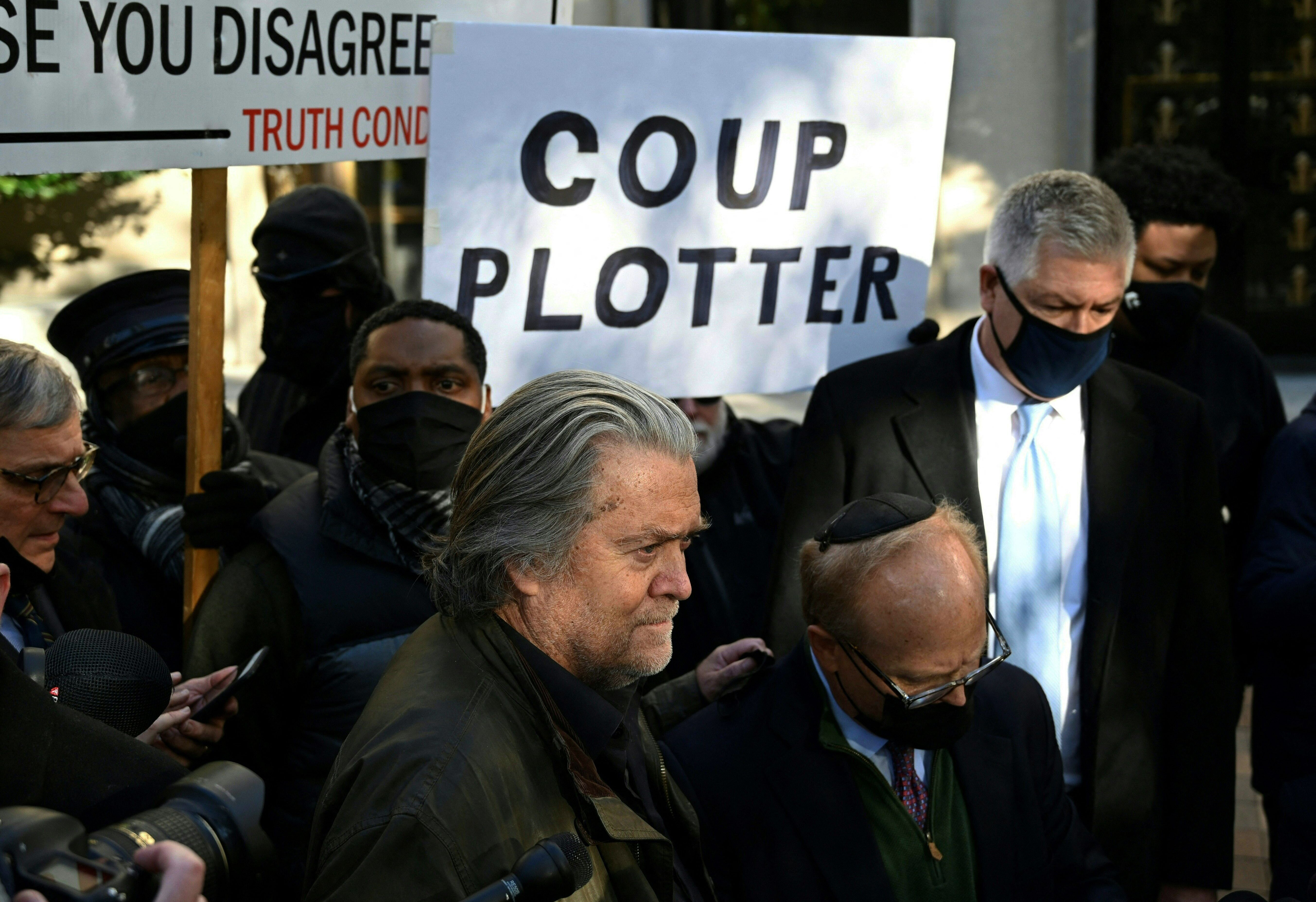 Protester With 'Coup Plotter' Sign Rains On Steve Bannon's Propaganda ...