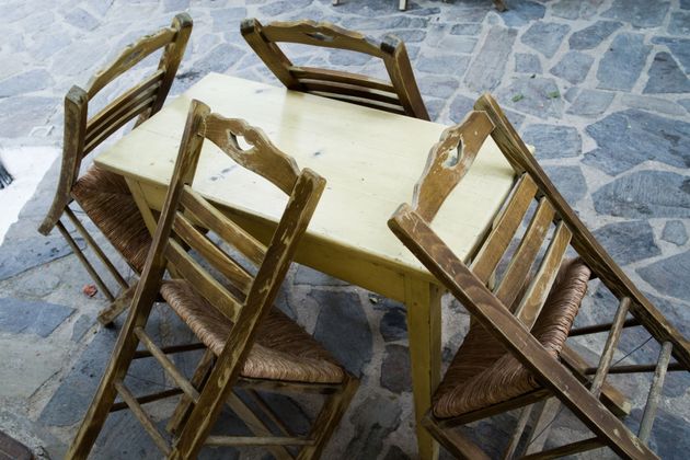 The detail from the village Leptopoda on island Chios, Greece. Four greek old and used traditional chairs...
