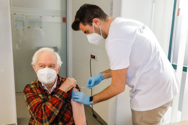 An Austrian resident receives the Pfizer vaccine
