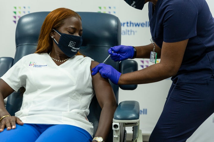 Nurse Sandra Lindsay receives the COVID-19 Pfizer vaccine booster at Teaching Center LIJ Medical Center. Lindsay was the first person to receive a coronavirus vaccine in the U.S. on Dec.14, 2020.