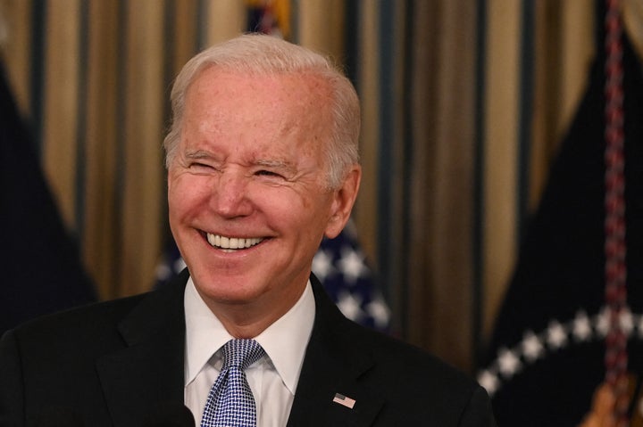 US President Joe Biden reacts as he delivers remarks on the passage of the Bipartisan Infrastructure Deal and the rule that will allow the passage of the Build Back Better Act in the State Dining Room at the White House in Washington, DC on November 6, 2021. 