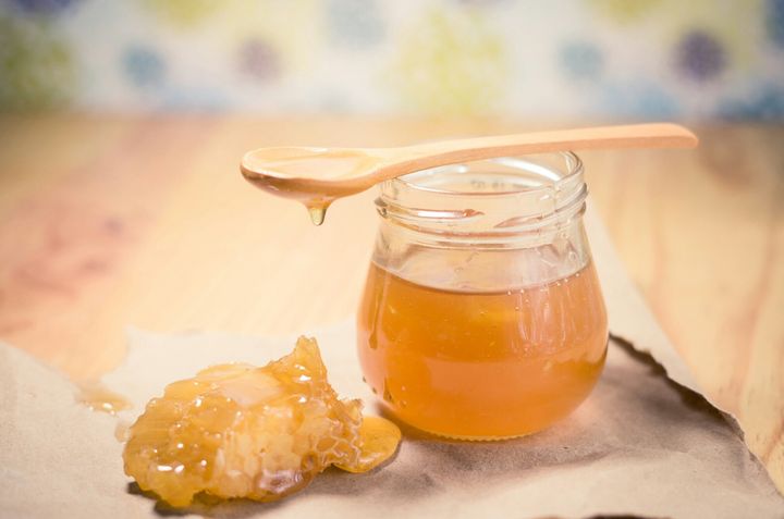 A spoonful of honey can minimize coughing and soothe a scratchy throat, as long as your kid is the appropriate age.