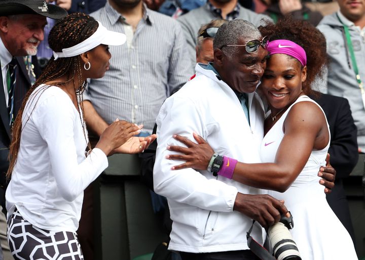 Serena Williams, right, with her father, Richard Williams, and sister Venus Williams after winning a match July 7, 2012, at the Wimbledon Lawn Tennis Championships in London.