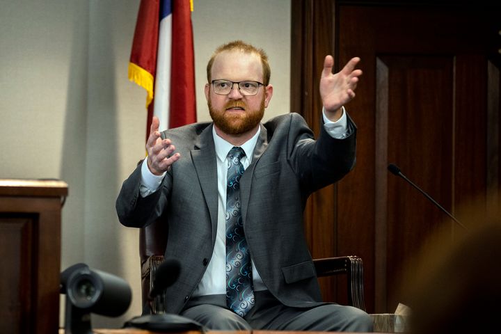 Travis McMichael speaks from the witness stand during his trial Wednesday, Nov. 17, 2021, in Brunswick, Georgia. McMichael, his father Greg McMichael and their neighbor, William "Roddie" Bryan, are charged with the February 2020 death of 25-year-old Ahmaud Arbery. 