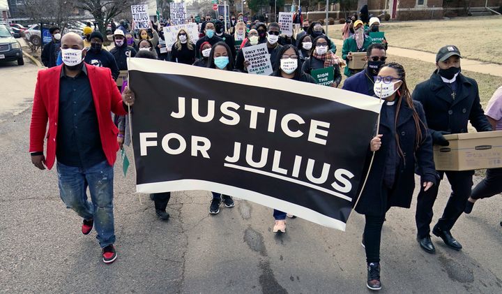 Supporters of Julius Jones march to the offices of the Oklahoma Pardon and Parole Board on Thursday, Feb. 25, 2021, in Oklahoma City, where they presented a petition with over 6.2 million signatures, calling for Jones' death sentence to be commuted. (AP Photo/Sue Ogrocki)