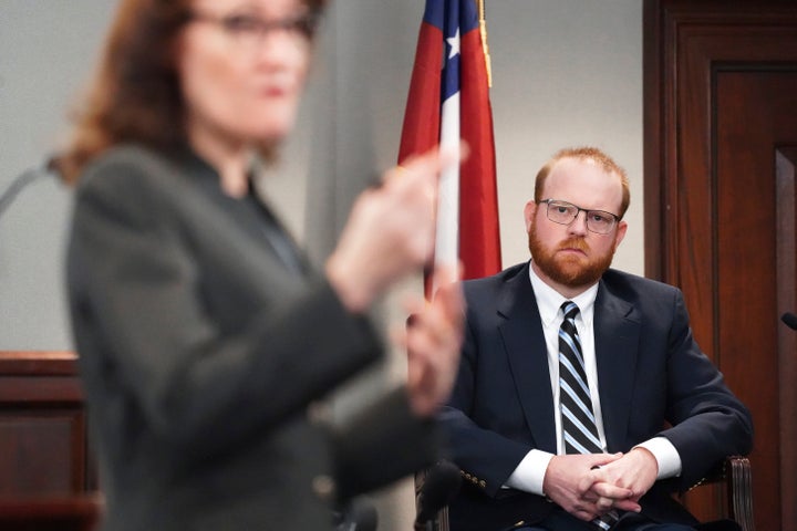 Defendant Travis McMichael testifies under cross-examination by prosecutor Linda Dunikoski at the Glynn County courthouse, Nov. 18, in Brunswick, Georgia.