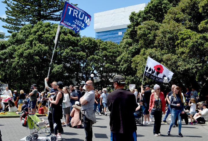 Some rallygoers carried Donald Trump flags as they protested vaccine mandates and pandemic restrictions in New Zealand.