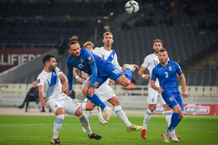 Kosovo's Vedat Muriqi (C) fights for the ball with Greece's Georgios Tzavellas during their FIFA World Cup Qatar 2022 qualification football match between Greece and Kosovo at the OAKA Spiros Louis stadium in Athens on November 14, 2021. (Photo by Angelos Tzortzinis / AFP) (Photo by ANGELOS TZORTZINIS/AFP via Getty Images)