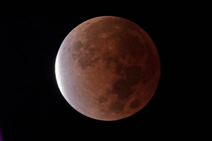 The earth's shadow covers the full moon during a partial lunar eclipse, early Friday, Nov. 19, 2021, in Kansas City, Mo. NASA and the nation's top federal nuclear research lab on Friday, Nov. 19, put out a request for proposals for a fission surface power system. NASA is collaborating with the U.S. Department of Energy's Idaho National Laboratory to establish a sun-independent power source for missions to the moon by the end of the decade. (AP Photo/Charlie Riedel)