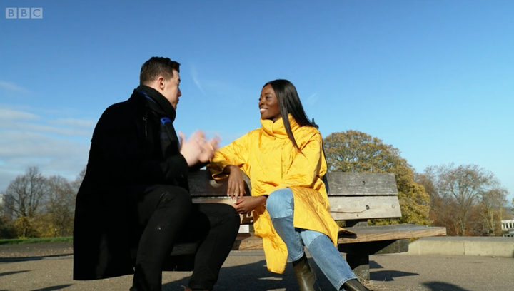 Kai Widdrington and AJ Odudu chatting in a park during a pre-recorded video