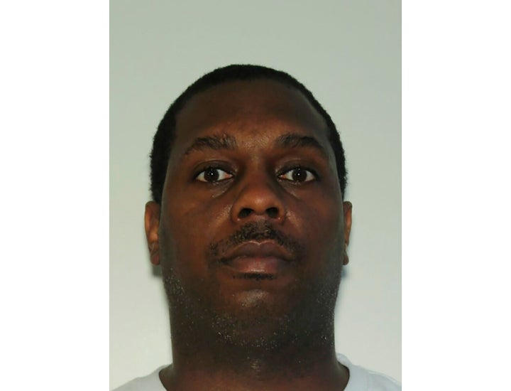 Kenny Wells was awaiting a bag search at the Atlanta airport's main security checkpoint when he reached into his bag and grabbed a firearm, causing it to go off, authorities said.