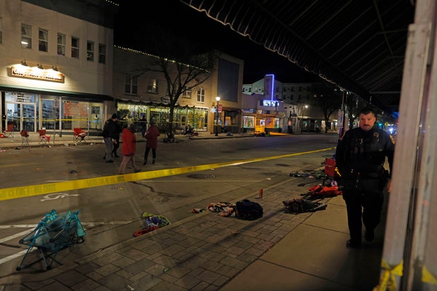 Police canvass the streets in downtown Waukesha, Wis., after a vehicle plowed into a Christmas parade hitting more than 20 people Sunday, Nov. 21, 2021. (AP Photo/Jeffrey Phelps)