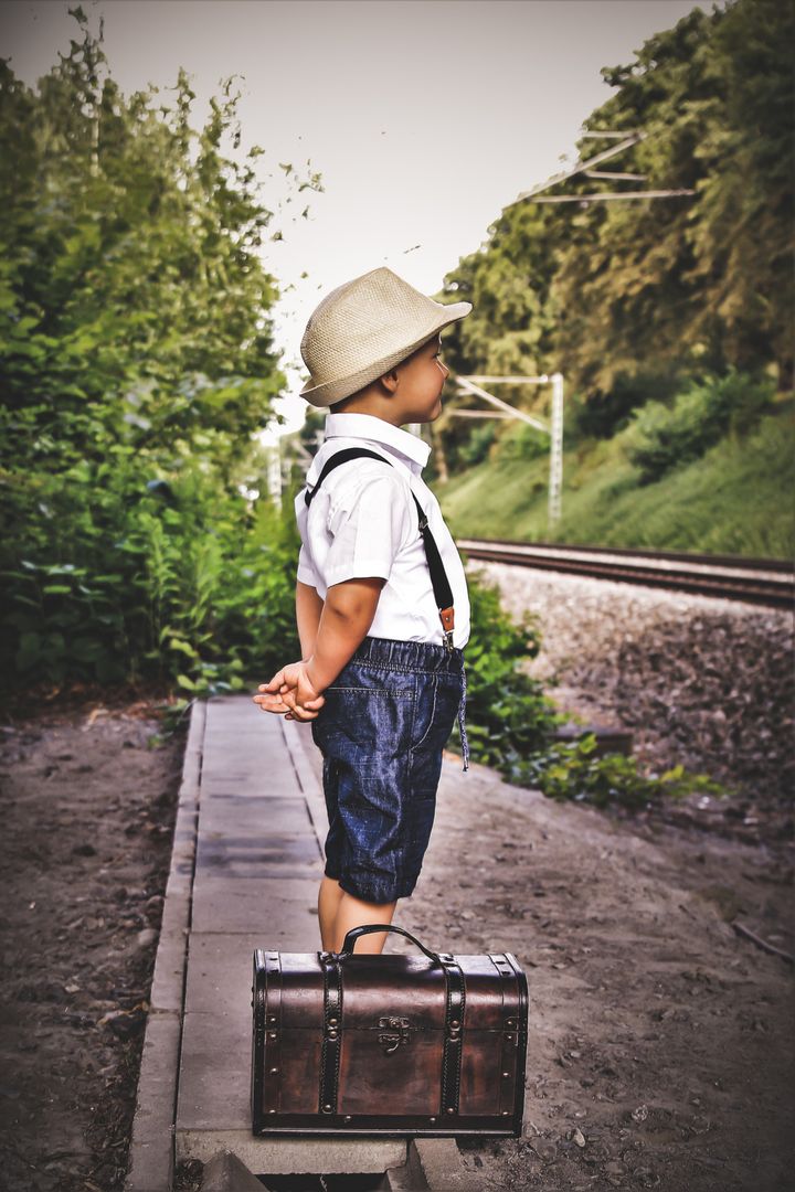 A young traveller waits patiently at the platform in Soest, Germany, for his train to take him on an adventure. Photographed by Sabrina Hugendick.