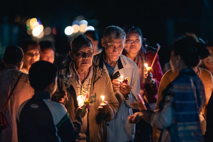 Locals attend a spiritual ritual ceremony in Laos captured by Mutin Antoine.