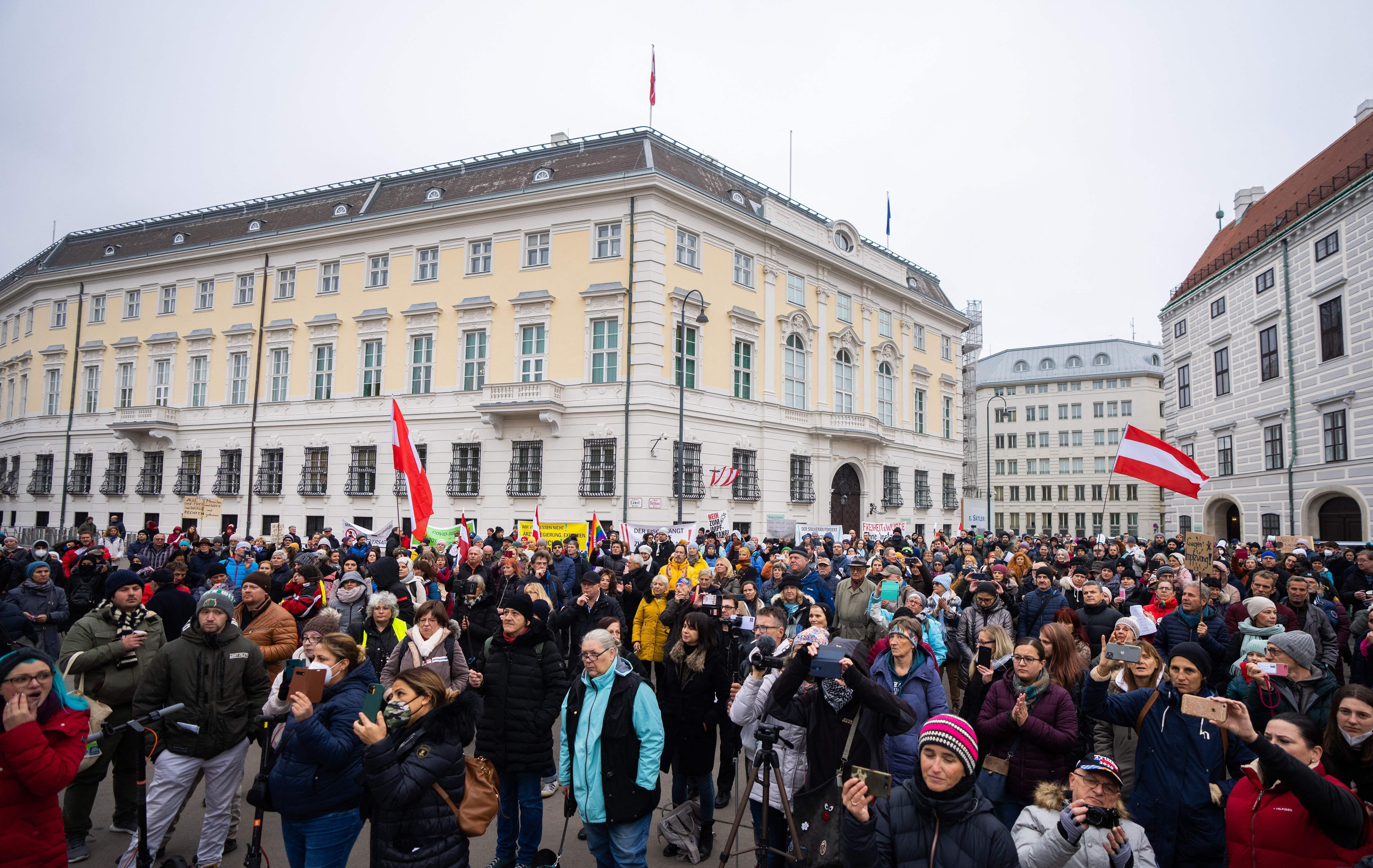 Anti-vaccination demonstrators protest at the Ballhausplatz in Vienna, Austria, on November 14, 2021/ 