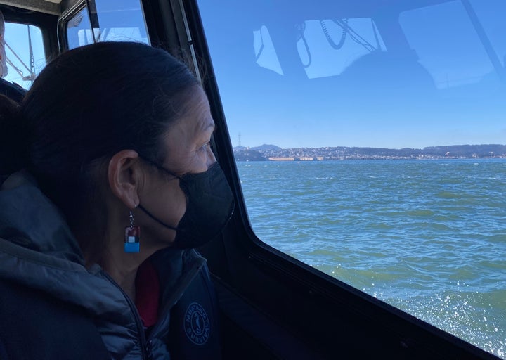 Haaland looks out at Alcatraz Island from a boat crossing the San Francisco Bay.