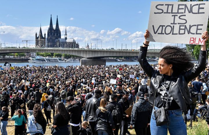 Thousands demonstrate in Cologne, Germany, in 2020 against racism and the murder of a Black man, George Floyd, by police in Minneapolis in the U.S.. Floyd's death led to Black Lives Matter protests in many countries and across America.