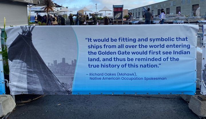 A banner set up next to the ferry taking people to Alcatraz Island.