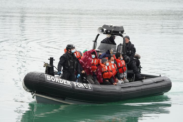 A group of people thought to be migrants are brought in to Dover, Kent, by a Border Force vessel, following a small boat incident in the Channel in November.