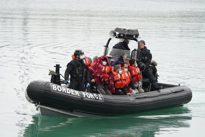 A group of people thought to be migrants are brought in to Dover, Kent, by a Border Force vessel, following a small boat incident in the Channel in November.