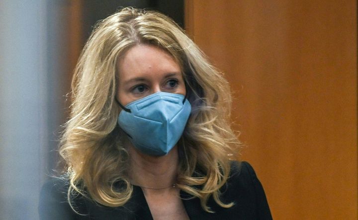 Elizabeth Holmes goes through security after arriving for court at the Robert F. Peckham Federal Building on Nov. 22, 2021, in San Jose, California.