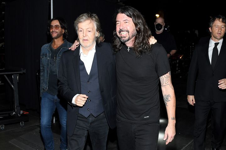 Paul McCartney and Dave Grohl embrace backstage during the 36th Annual Rock & Roll Hall of Fame Induction Ceremony in October.