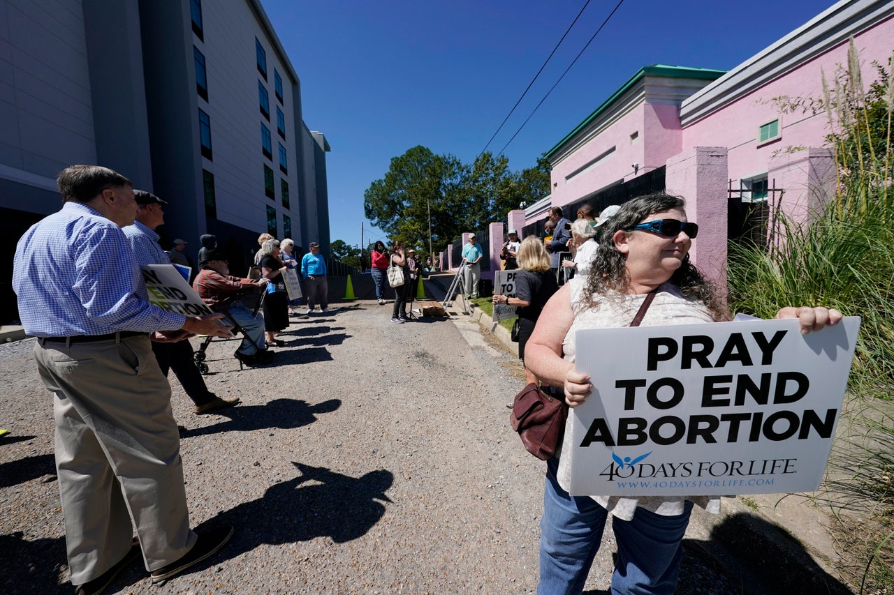 Anti-abortion protesters stand outside the Jackson Women's Health Organization clinic and shut down part of the street on Sept. 22, 2021.