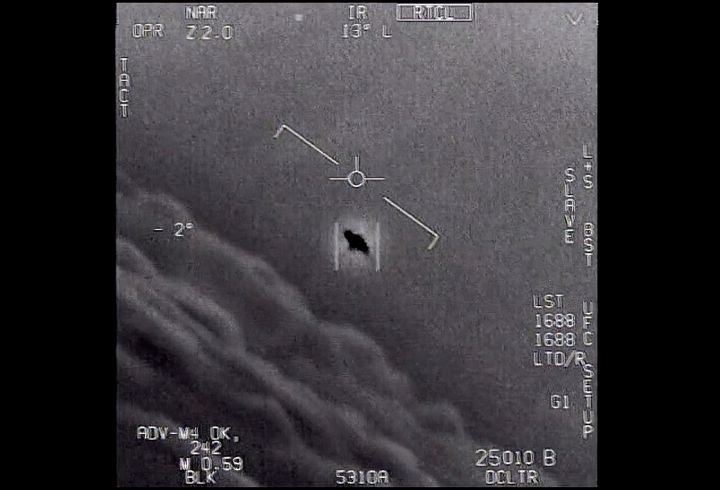 The Department of Defense says this image from a 2015 video labeled Gimbal shows an unexplained object as it is tracked flying along the clouds and traveling against the wind.