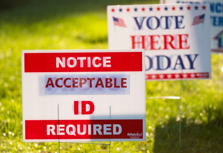 Voter ID signs greet voters in Ruckersville, Virginia, on last November's Election Day. The U.S. Supreme Court announced Wednesday that it will hear a case over the right to defend a voter identification law in North Carolina.