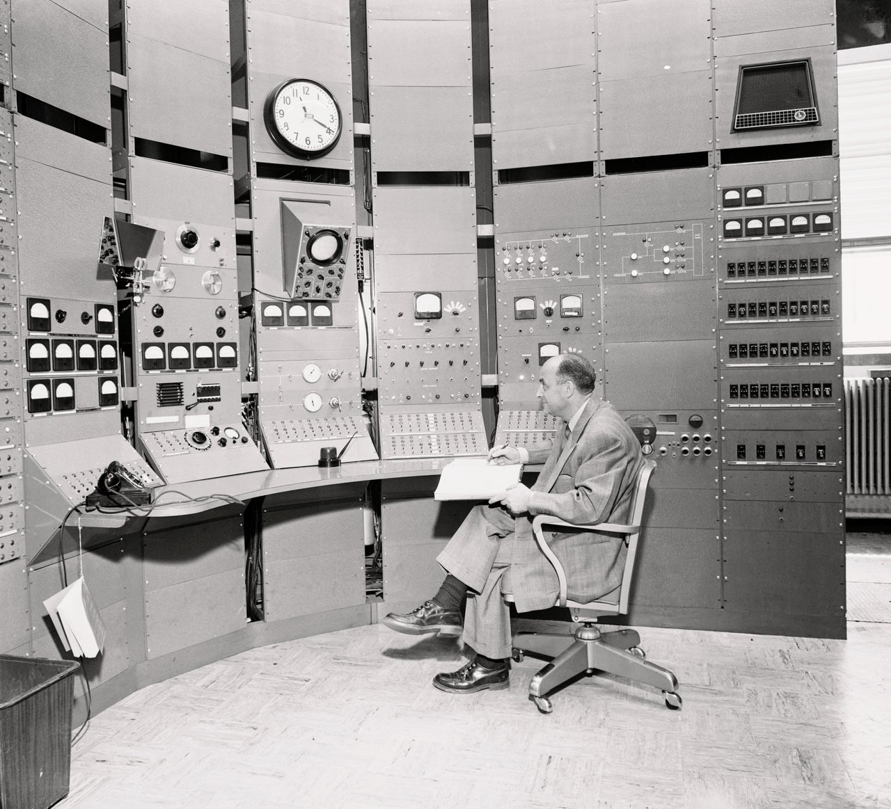 Enrico Fermi, who supervised the first atomic chain reaction in history, at a University of Chicago atom smasher.