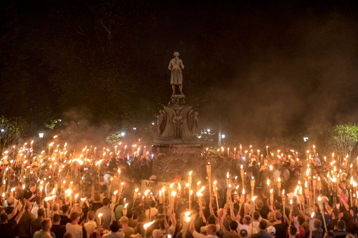 A group of torch-bearing white nationalists rally around a statue of Thomas Jefferson on Aug. 11, 2017, in Charlottesville, Virginia.