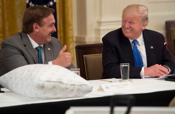 President Donald Trump with Mike Lindell, founder of MyPillow, at a U.S. manufacturers' event in 2017 at the White House. Lindell acted as an unofficial adviser to Trump and has continued to amplify his lies about the 2020 election.