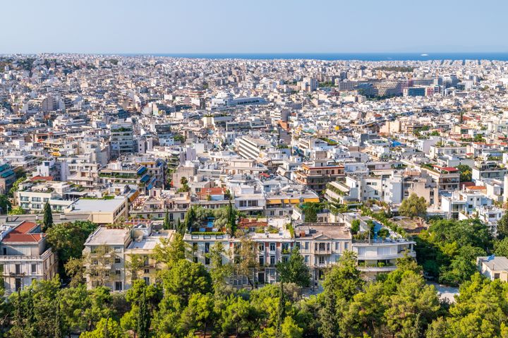 This is an overview of the historical city of Athens, Greece with the Saronic gulf in the background. It is shot from the Acropolis.