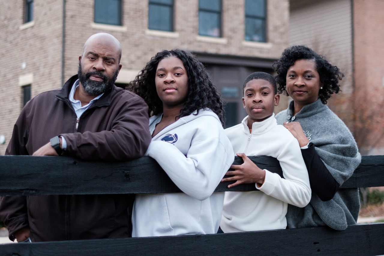Katrece Nolen, at right, stands for a portrait with family on Nov. 20 in Chantilly, Virginia. Nolen is a mother of two children currently attending Loudoun County Public Schools.