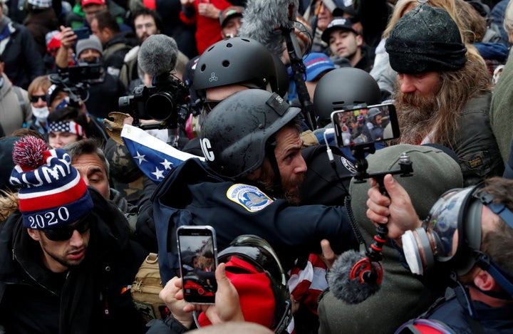 The man known as "Swedish Scarf" (top right) is seen in crowds on Jan. 6.