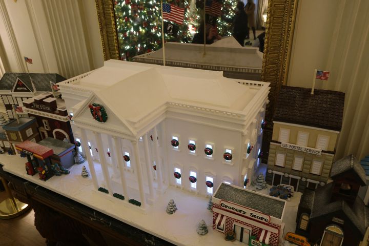 The official 2021 Gingerbread White House is displayed in the State Dining Room.